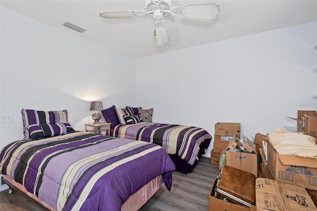 bedroom featuring ceiling fan and hardwood / wood-style floors