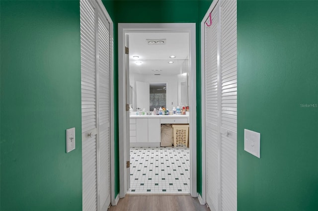 corridor featuring light hardwood / wood-style flooring