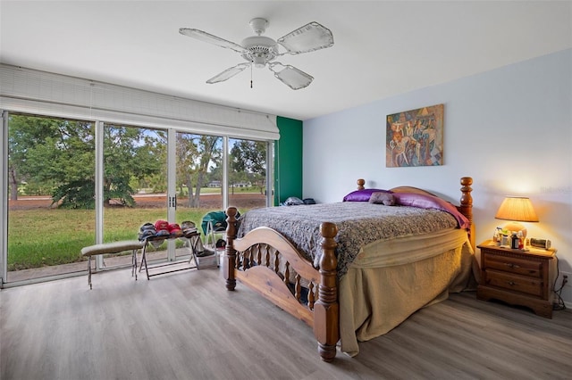 bedroom featuring ceiling fan and hardwood / wood-style floors