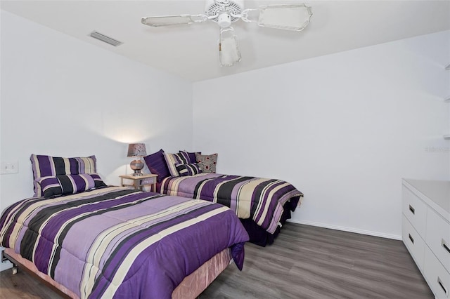 bedroom featuring ceiling fan and dark hardwood / wood-style flooring