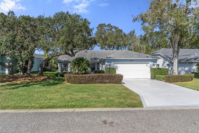 ranch-style home with a garage and a front lawn