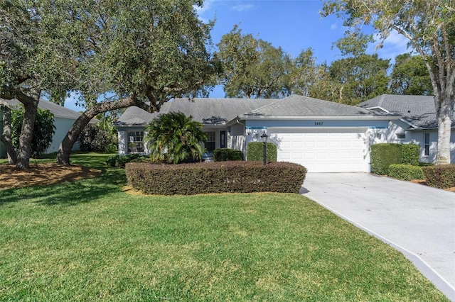 ranch-style home with a garage and a front lawn