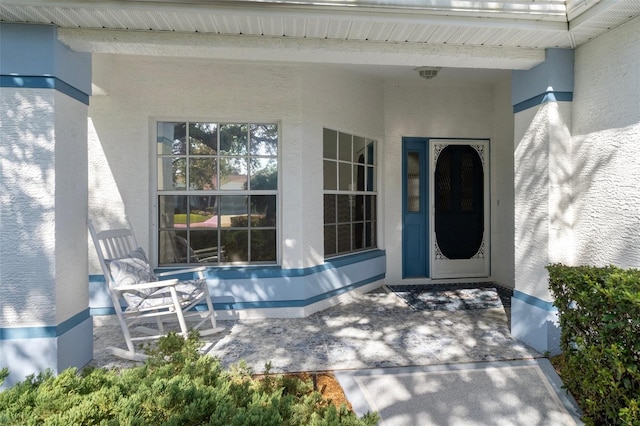 entrance to property with covered porch