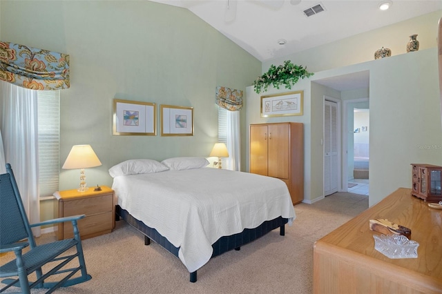 carpeted bedroom with multiple windows, connected bathroom, a closet, and ceiling fan