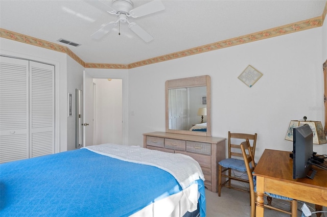 bedroom featuring carpet floors, a closet, and ceiling fan