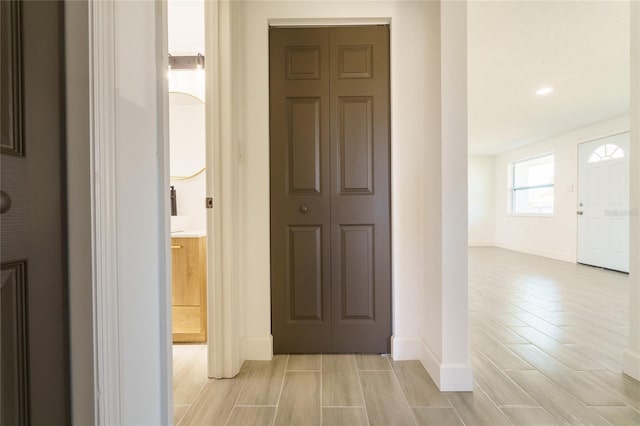 hall with light wood-type flooring