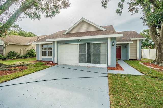 view of front facade featuring a garage and a front lawn