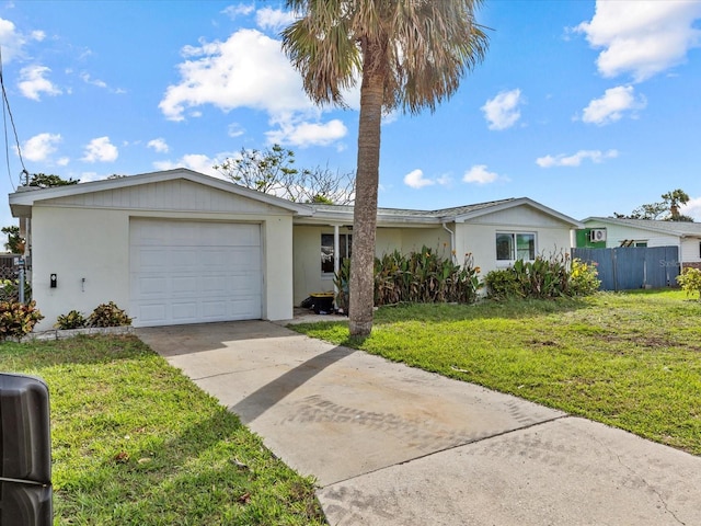 single story home featuring a garage and a front yard