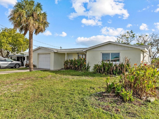 ranch-style home with a front yard and a garage