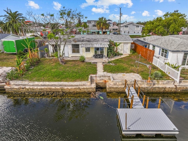 exterior space with a lawn and a water view