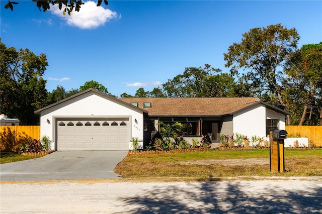 ranch-style home featuring a garage and a front yard