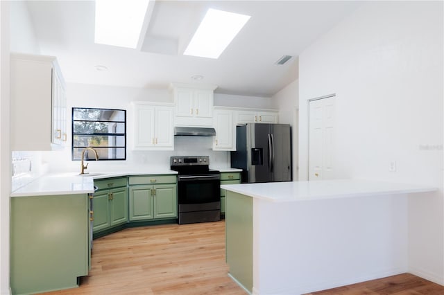 kitchen with white cabinets, stainless steel fridge with ice dispenser, electric range, and light hardwood / wood-style floors