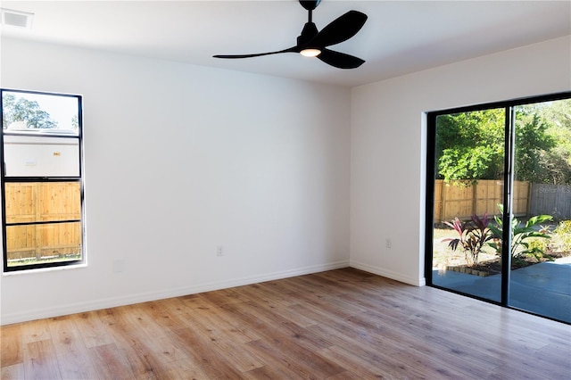 unfurnished room with ceiling fan and light hardwood / wood-style flooring