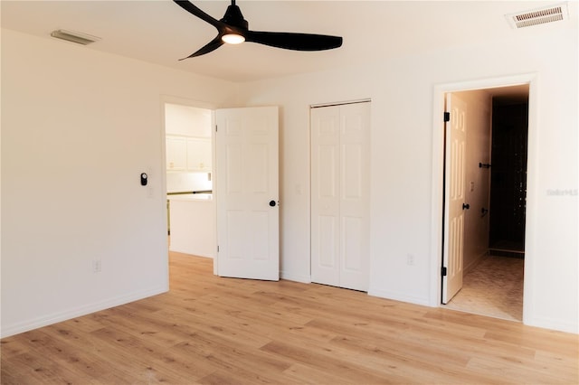 unfurnished bedroom featuring ceiling fan and light hardwood / wood-style flooring