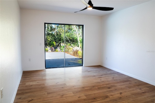 spare room with ceiling fan and hardwood / wood-style floors