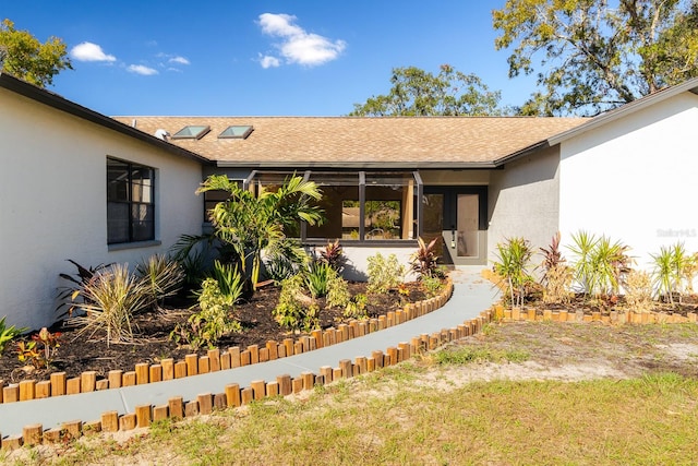 property entrance featuring a yard