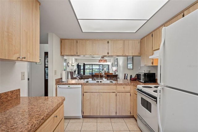 kitchen featuring sink, white appliances, light brown cabinetry, light tile patterned floors, and custom exhaust hood