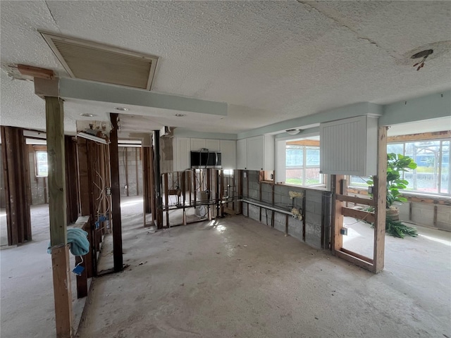 miscellaneous room featuring a textured ceiling