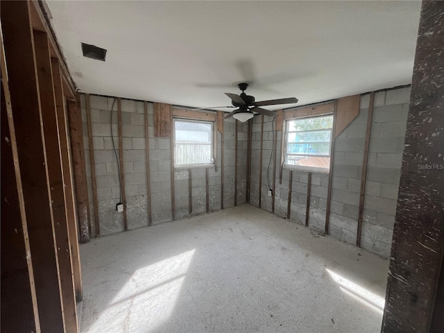 basement with ceiling fan