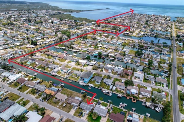 aerial view featuring a residential view and a water view