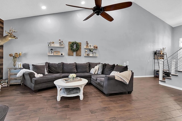 living room with dark hardwood / wood-style floors, high vaulted ceiling, and ceiling fan