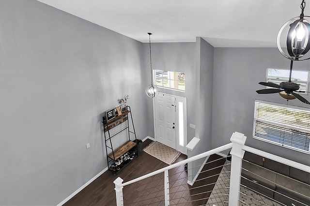 foyer featuring dark hardwood / wood-style floors, ceiling fan, and lofted ceiling