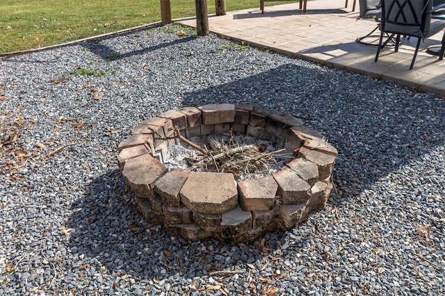 exterior details with an outdoor fire pit