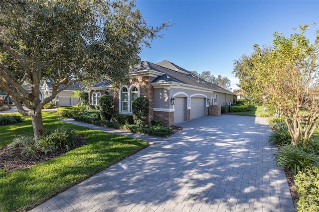 view of front of home featuring a garage and a front yard