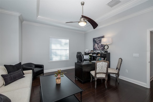 office with a tray ceiling, ceiling fan, dark wood-type flooring, and ornamental molding