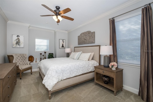 carpeted bedroom featuring ceiling fan and ornamental molding