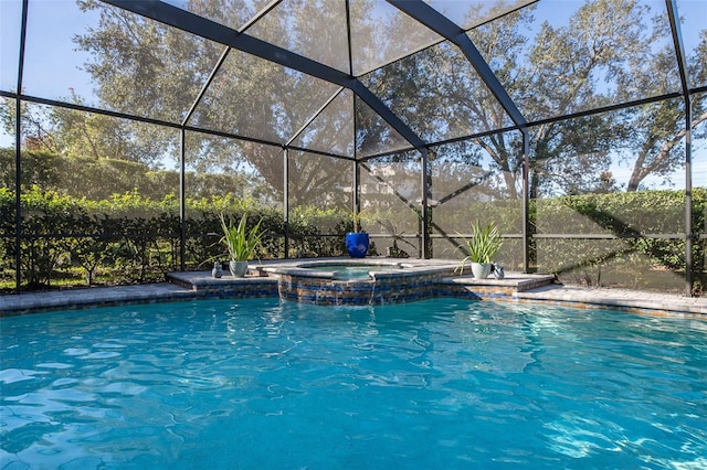 view of pool featuring a lanai and an in ground hot tub