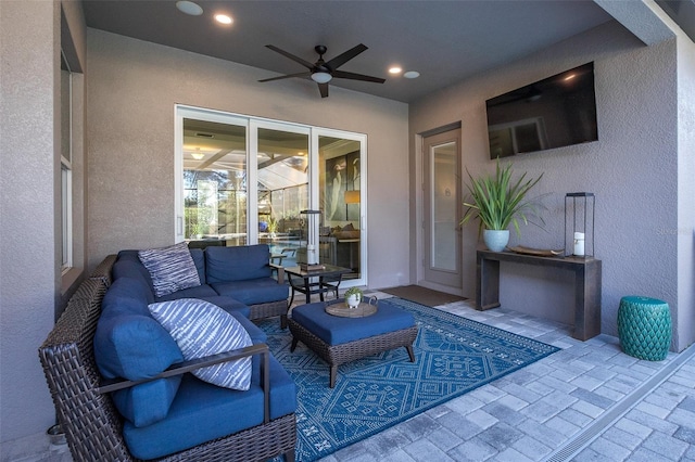 view of patio with ceiling fan and an outdoor hangout area