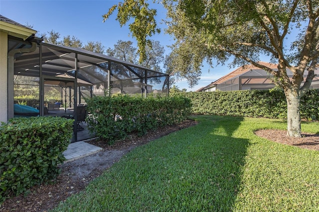 view of yard with a lanai