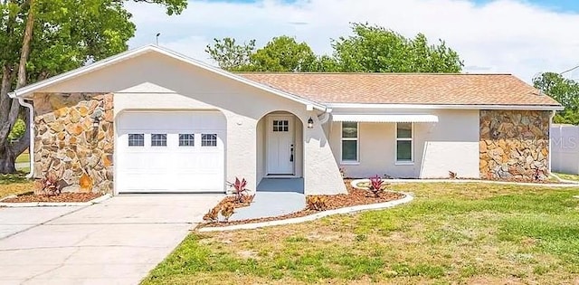 ranch-style house with a front yard and a garage