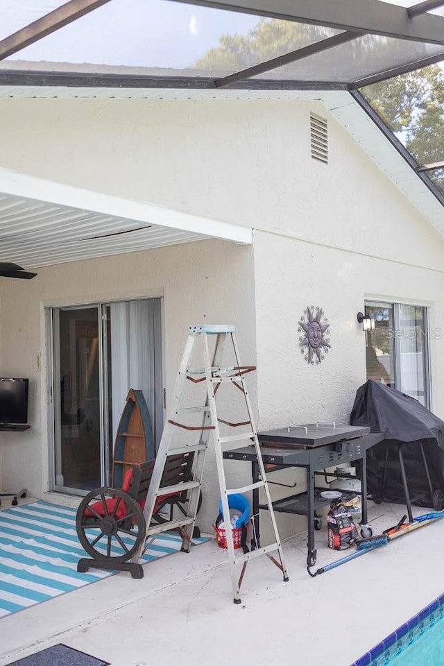 back of house with a patio area, a lanai, and a swimming pool