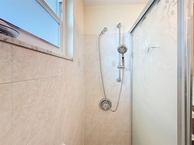 bathroom with tiled shower