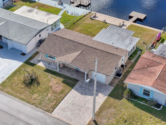 birds eye view of property featuring a water view