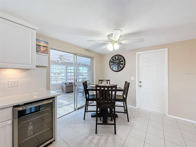 dining area with wine cooler, light tile patterned floors, and ceiling fan