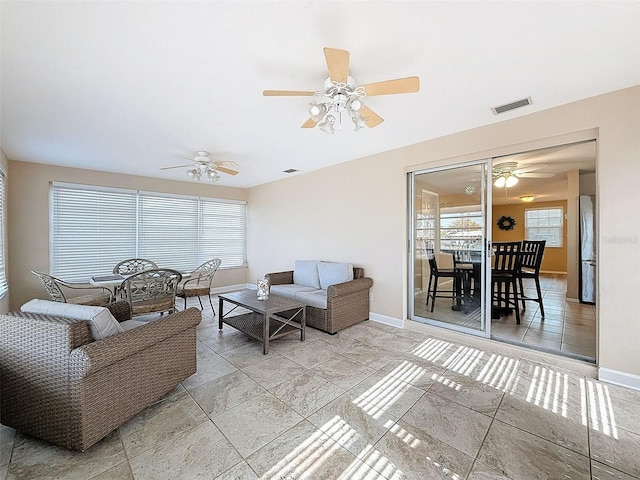 living room with ceiling fan