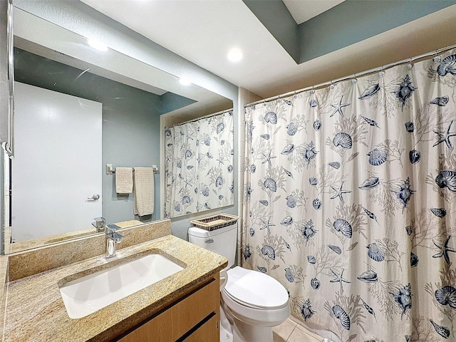 bathroom featuring tile patterned flooring, vanity, and toilet