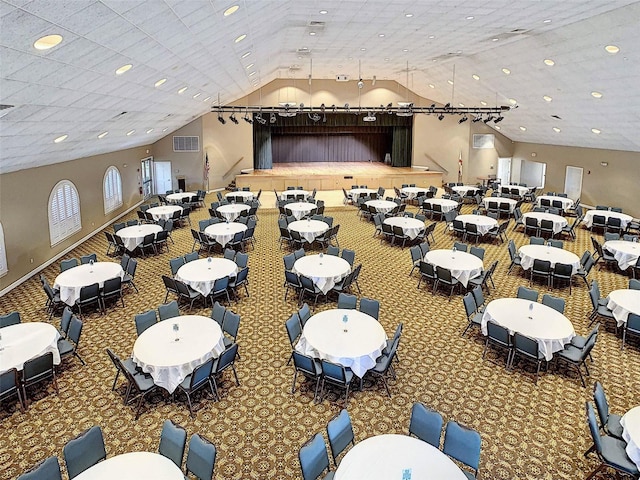 interior space featuring carpet and lofted ceiling