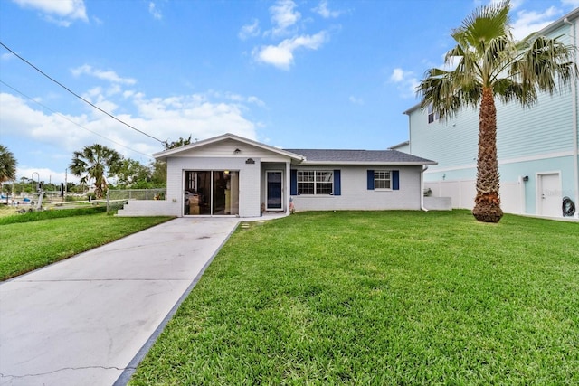 ranch-style home featuring a front yard