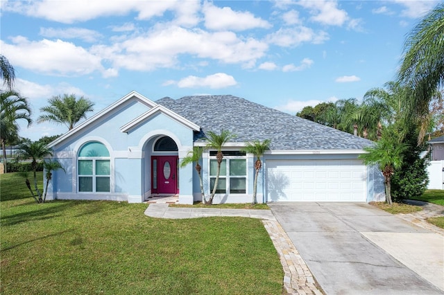 ranch-style home featuring a front yard and a garage