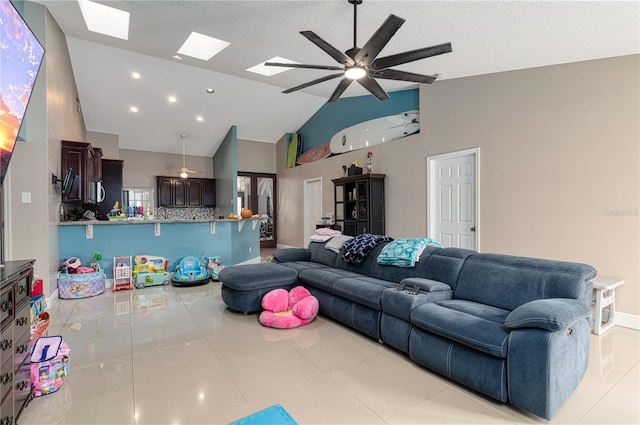 tiled living room featuring ceiling fan, high vaulted ceiling, and a textured ceiling