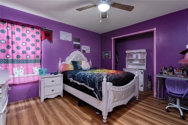 bedroom with ceiling fan and light hardwood / wood-style flooring