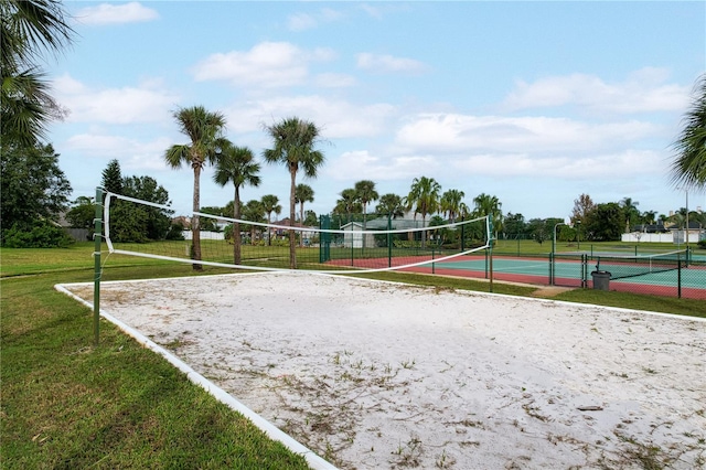 surrounding community featuring volleyball court, a lawn, and tennis court