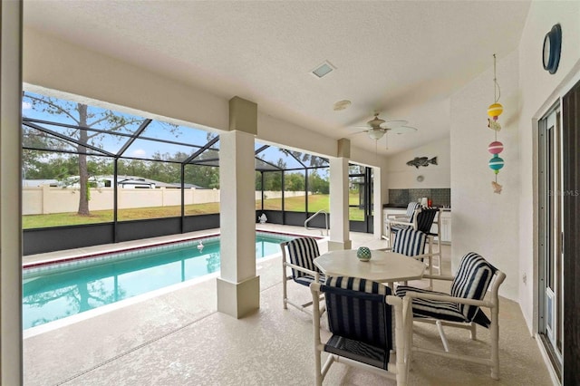 view of pool with a patio area, ceiling fan, and a lanai