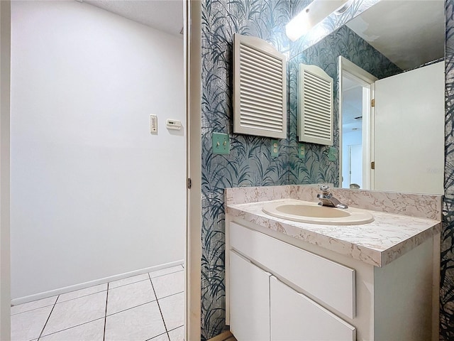 bathroom with tile patterned floors, vanity, and radiator