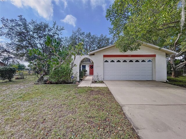 single story home featuring a garage