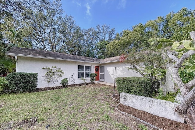 exterior space with a front lawn